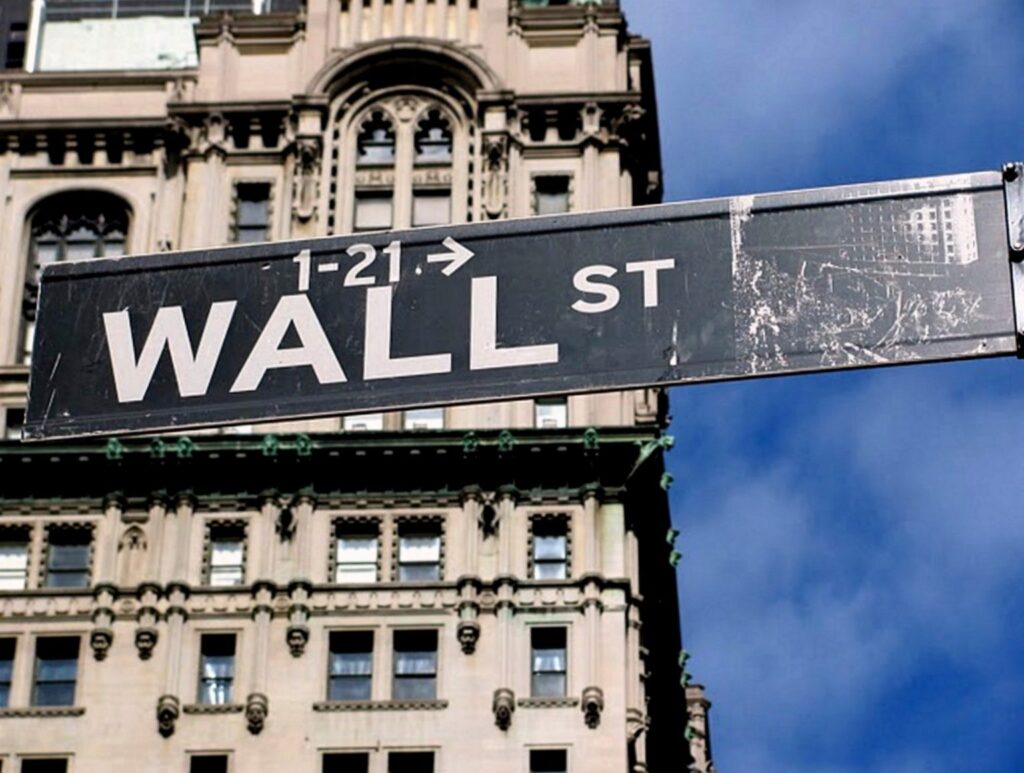 Sign Brodway crossing Wall Street scaled 1